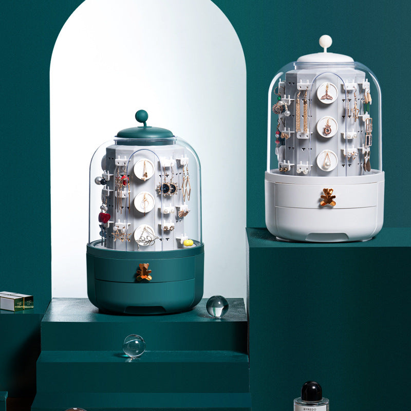 Two jewelry display cases on a teal and white background