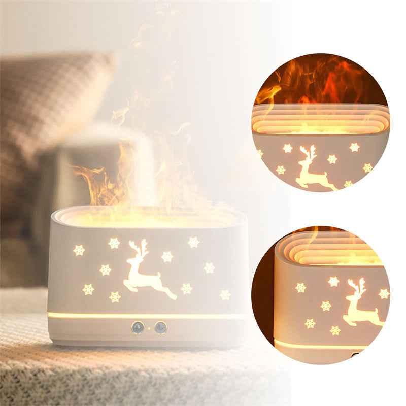 White night light with reindeer and star designs on a soft surface