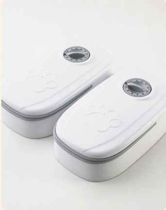 White electronic device with gray accents on a white background