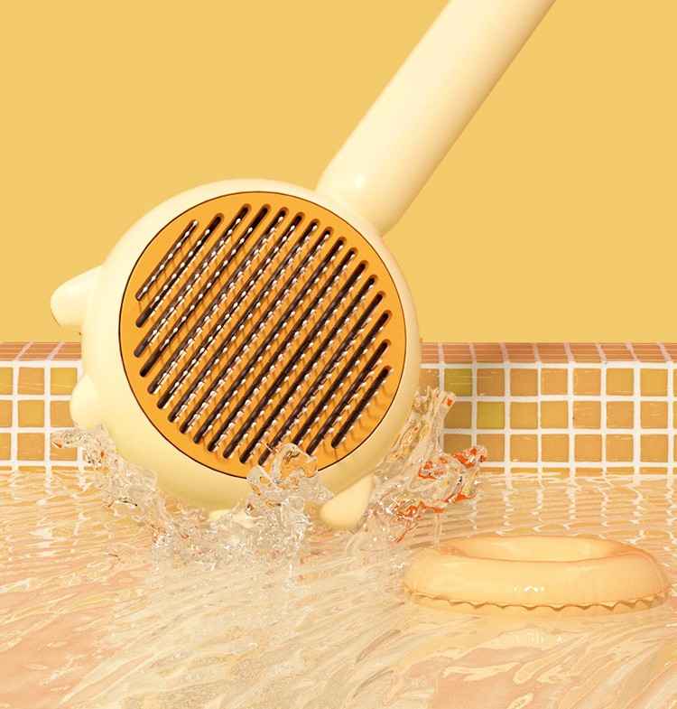 Yellow handheld shower head with water splashing around on a yellow background