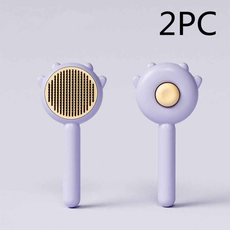Two purple grooming tools with gold centers on a light gray background, labeled '2PC'.