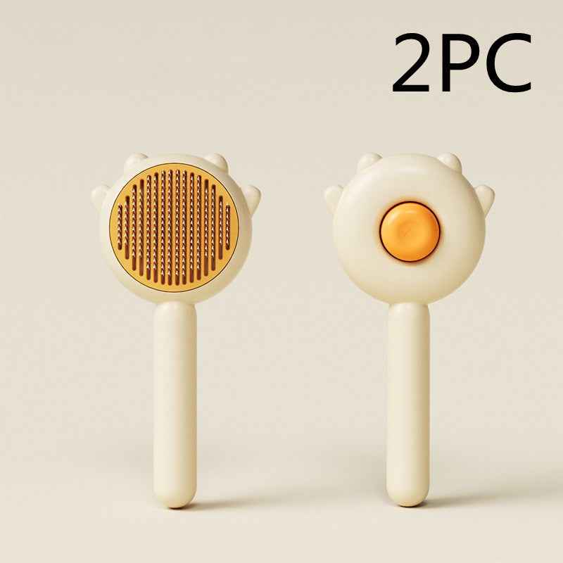 Two white handheld tools with orange centers on a light beige background, labeled '2PC'.