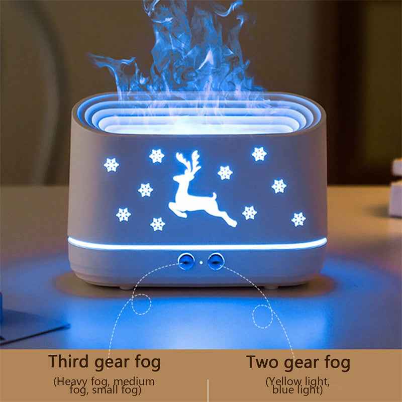 White diffuser with reindeer design on a table, emitting blue fog.