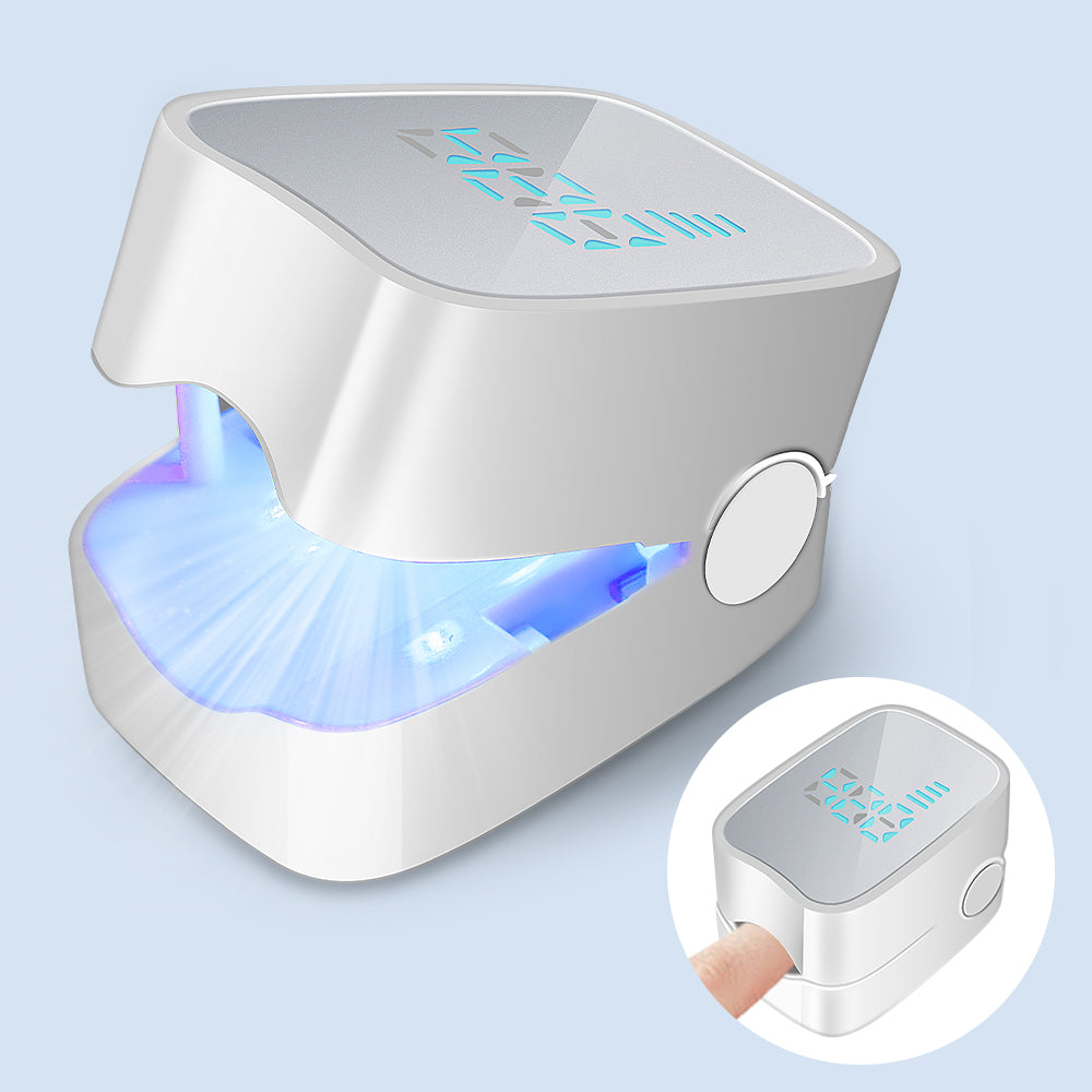 A white UV nail lamp with a blue illuminated interior, shown on a pale blue background. A circular inset at the bottom right shows a finger inserted into the device.