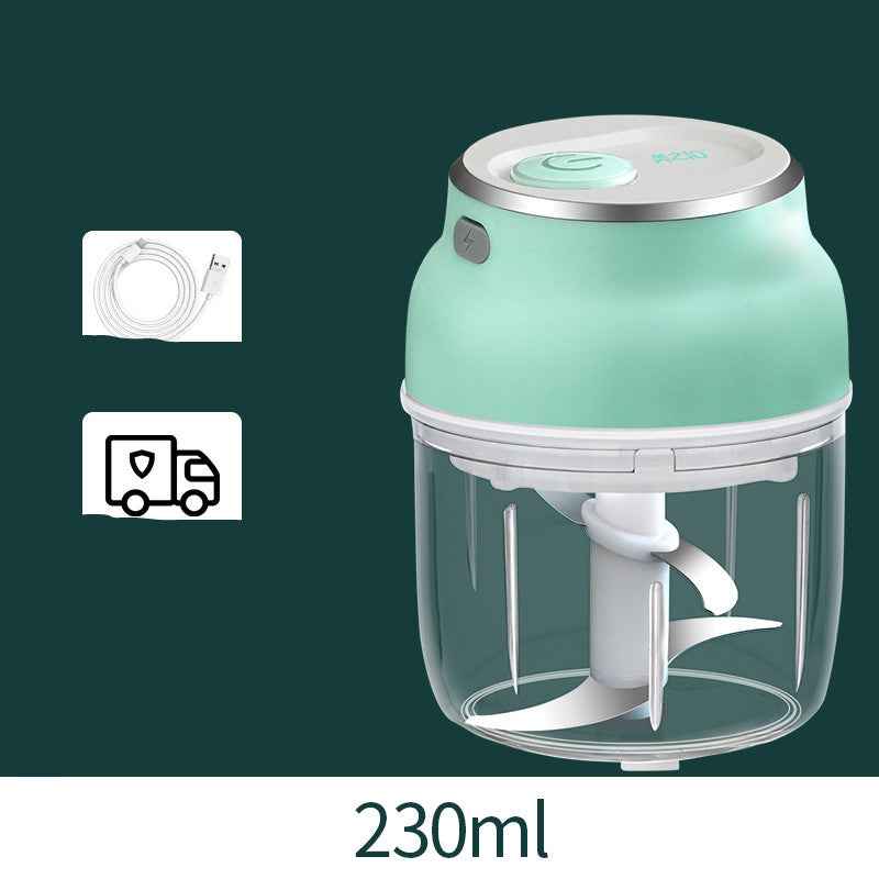 Green food chopper with clear container on a dark green background