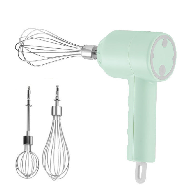 Mint green hand mixer with attachments on a white background