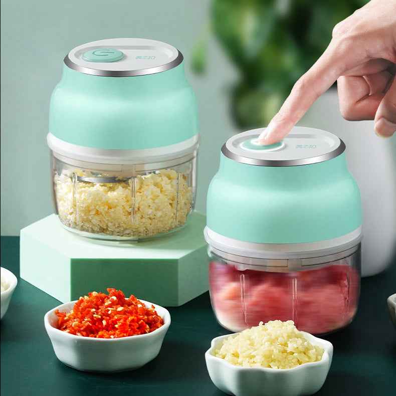 USB rechargeable mini garlic chopper for chopping garlic, ginger, vegetables, and herbs quickly in the kitchen.