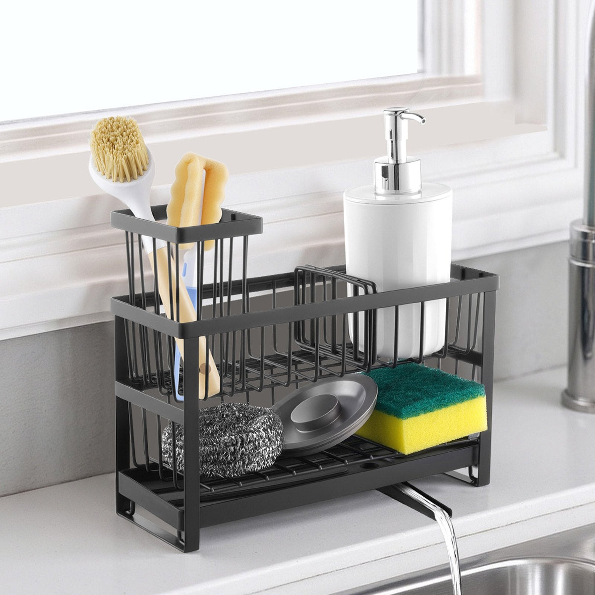 Black dish drying rack with kitchen utensils on a white countertop.