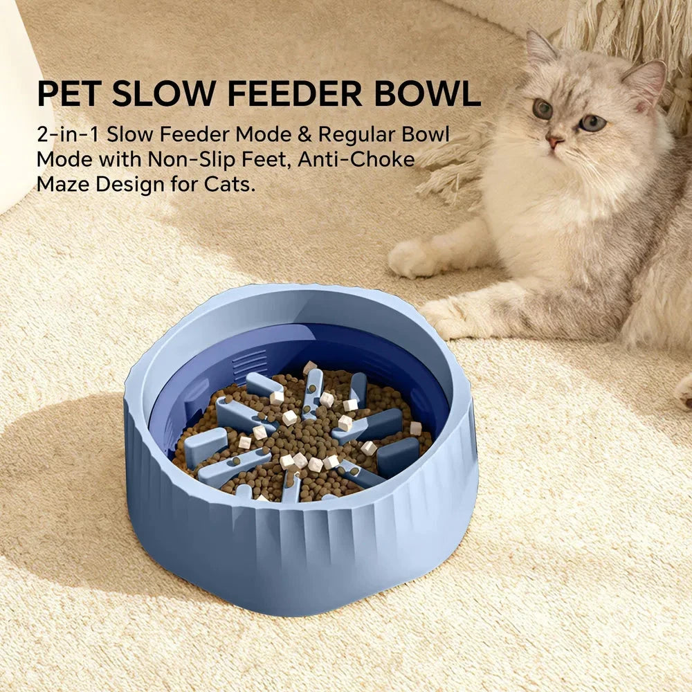 Pet slow feeder bowl with a cat sitting next to it on a carpeted floor.