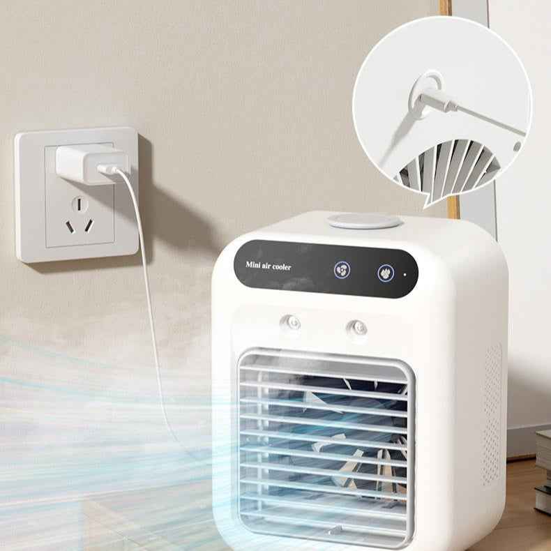 Portable air cooler plugged into an electrical outlet with a close-up of the fan blades.