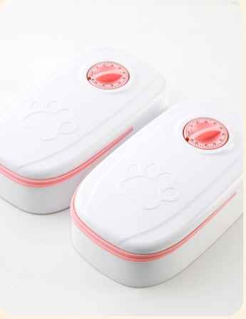 Two white containers with pink accents and red labels on a light gray background