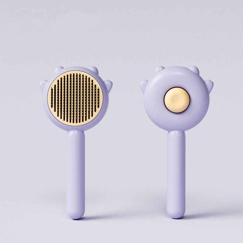 Two grooming tools with gold centers on a light purple background