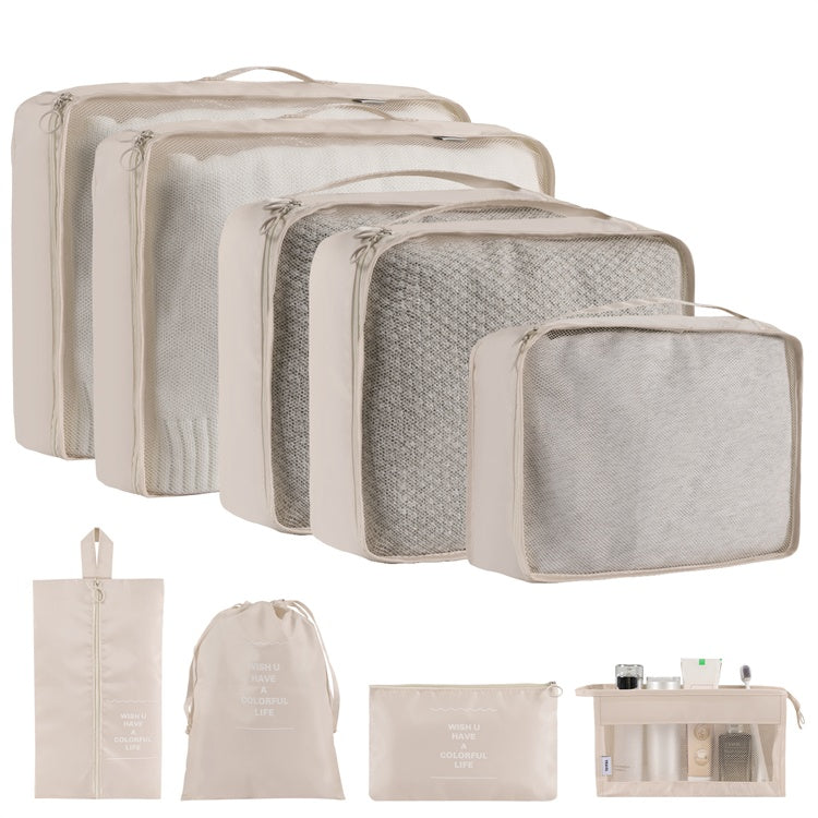 Set of beige and gray packing cubes and bags on a white background