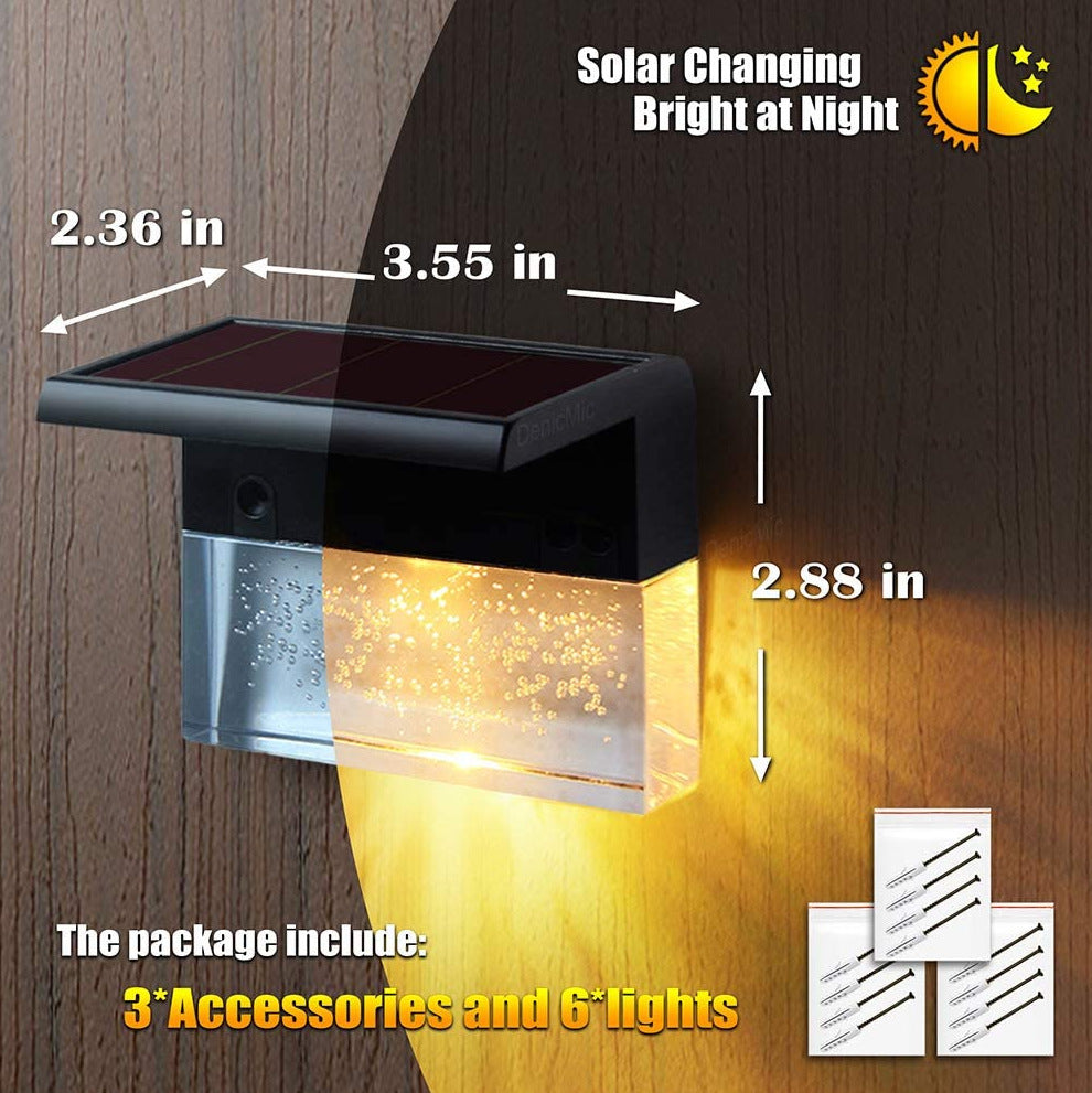Solar-powered outdoor light with dimensions and accessories information on a wooden background