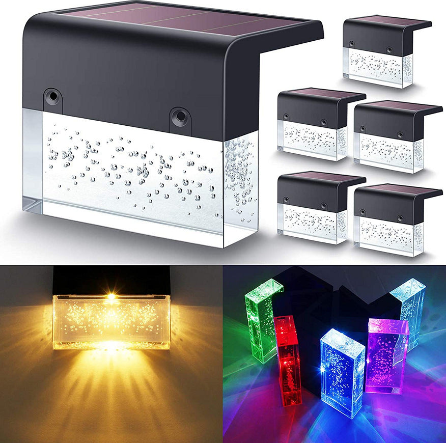 Solar-powered LED wall light with colorful lighting options on a white background