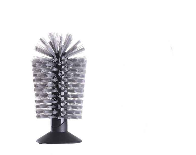 A cylindrical cleaning brush with dense gray and black bristles on a black plastic base, isolated on a white background.