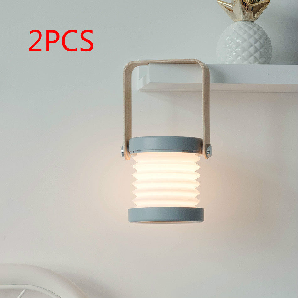 Modern wall-mounted light fixture with a soft glow on a neutral background, labeled '2PCS'.
