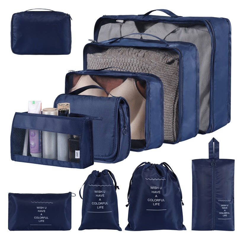 Set of blue packing cubes and bags with various compartments on a white background