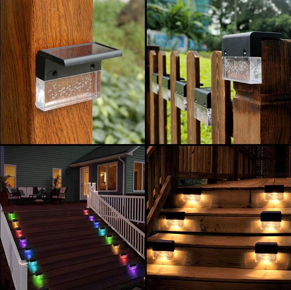 Solar-powered outdoor lights on wooden posts, railings, and steps with a blurred garden background.